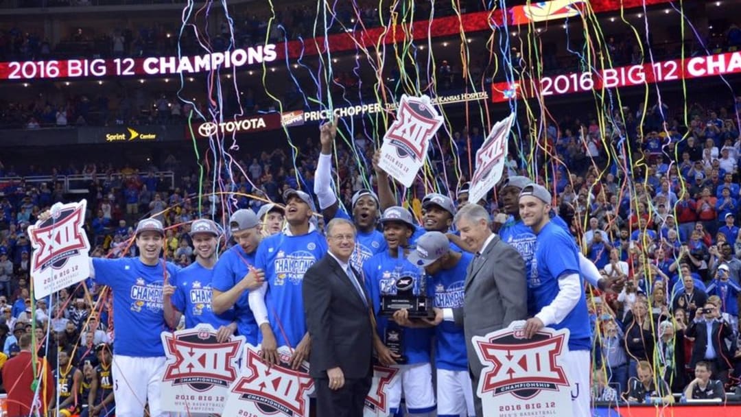 Mar 12, 2016; Kansas City, MO, USA; The Kansas Jayhawks celebrate with the trophy after the win over the West Virginia Mountaineers 81-71 in the championship game of the Big 12 Conference tournament at Sprint Center. Mandatory Credit: Denny Medley-USA TODAY Sports