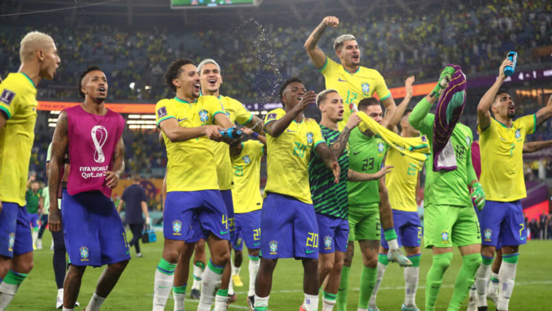 DOHA, QATAR - DECEMBER 05: Brazil players celebrate victory at full time and progression to the quarter finals of the FIFA World Cup during the FIFA World Cup Qatar 2022 Round of 16 match between Brazil and South Korea at Stadium 974 on December 5, 2022 in Doha, Qatar. (Photo by James Williamson - AMA/Getty Images)