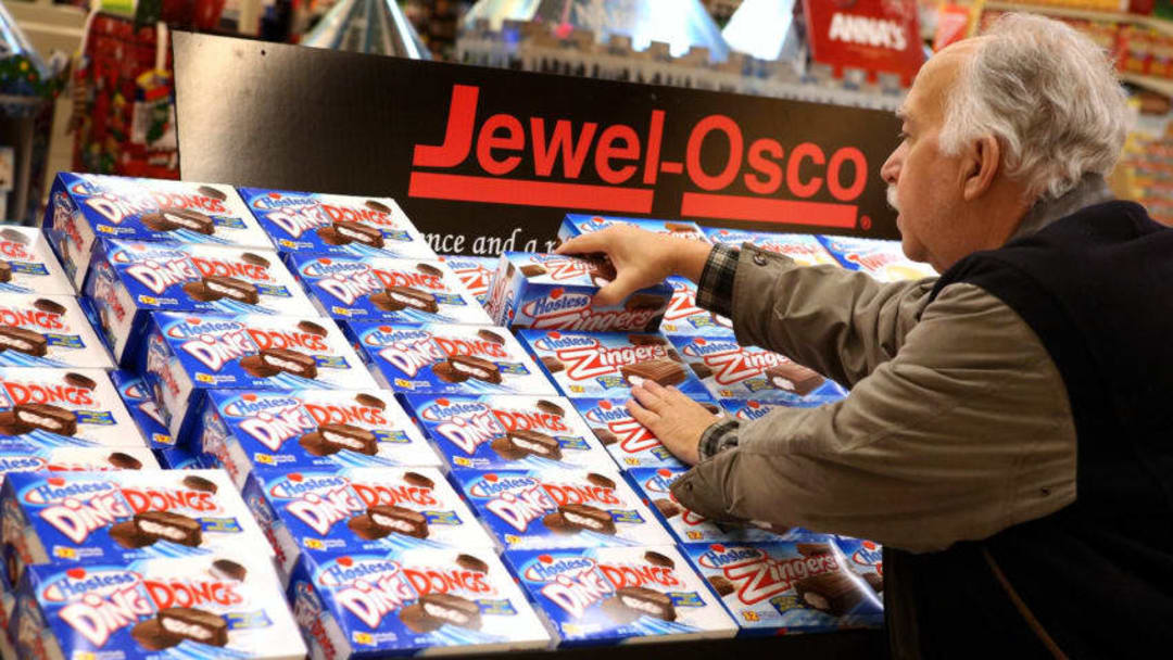 CHICAGO, IL - DECEMBER 11: Phil Colin buys Hostess snacks at a Jewel-Osco grocery store on December 11, 2012 in Chicago, Illinois. The Jewel-Osco grocery store chain purchased the last shipment of 20,000 boxes of Hostess products and put them on sale in their stores throughout the Chicago area today. Hostess Brands Inc. shut down its baking operations and began liquidating assets last month after failing to negotiate a labor contract with Workers with the Bakery, Confectionery, Tobacco Workers and Grain Millers International Union (Photo by Scott Olson/Getty Images)