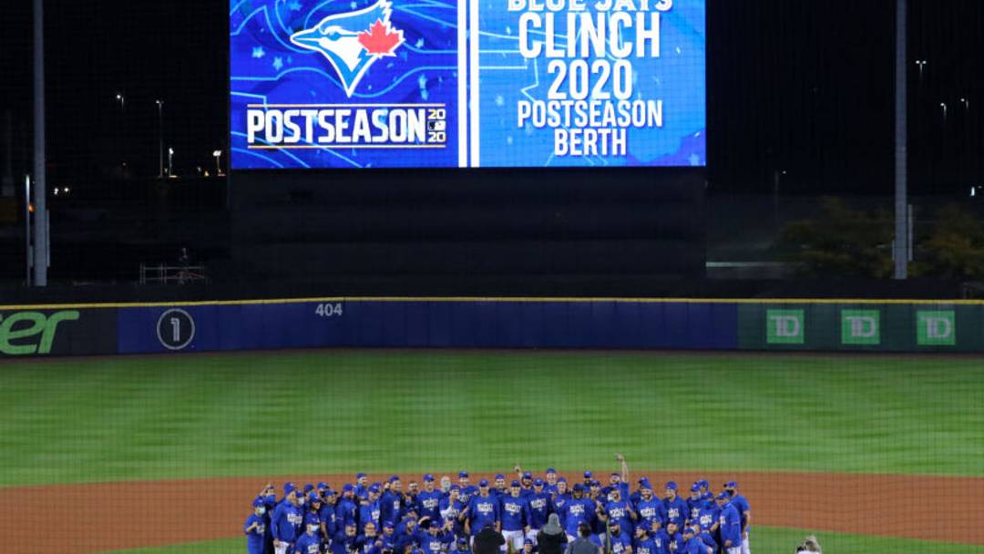 BUFFALO, NY - SEPTEMBER 24: The Toronto Blue Jays pose for a photo after beating the New York Yankees and clinching a 2020 postseason berth at Sahlen Field on September 24, 2020 in Buffalo, New York. The Blue Jays are the home team due to the Canadian government's policy on COVID-19, which prevents them from playing in their home stadium in Canada. Blue Jays beat the Yankees 4 to 1. (Photo by Timothy T Ludwig/Getty Images)