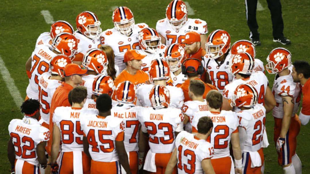 SANTA CLARA, CALIFORNIA - JANUARY 07: Head coach Dabo Swinney of the Clemson Tigers talks with his team against the Alabama Crimson Tide during the fourth quarter in the College Football Playoff National Championship at Levi's Stadium on January 07, 2019 in Santa Clara, California. (Photo by Lachlan Cunningham/Getty Images)