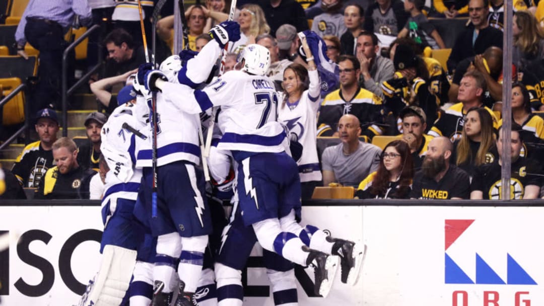 BOSTON, MA - MAY 4: Teammates swarm Dan Girardi #5 of the Tampa Bay Lightning after he scored the game winning goal during overtime of Game Four of the Eastern Conference Second Round during the 2018 NHL Stanley Cup Playoffs at TD Garden on May 4, 2018 in Boston, Massachusetts. The Lightning defeat the Bruins 4-3. (Photo by Maddie Meyer/Getty Images)