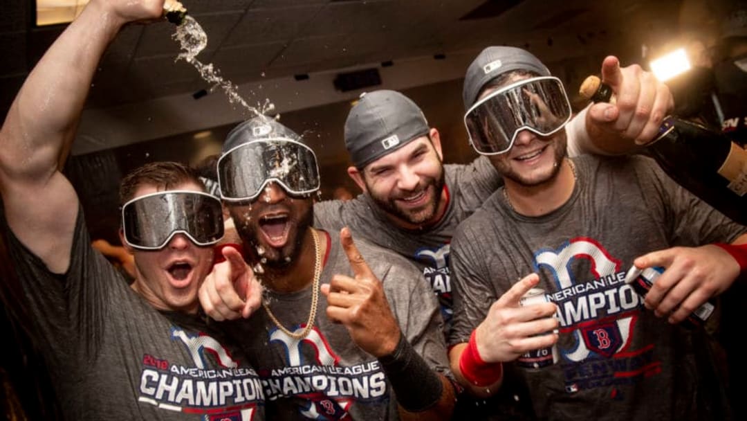 HOUSTON, TX - OCTOBER 18: Brock Holt #12, Eduardo Nunez #36, Mitch Moreland #18, and Andrew Benintendi #16of the Boston Red Sox celebrate with champagne in the clubhouse after clinching the American League Championship Series in game five against the Houston Astros on October 18, 2018 at Minute Maid Park in Houston, Texas. (Photo by Billie Weiss/Boston Red Sox/Getty Images)