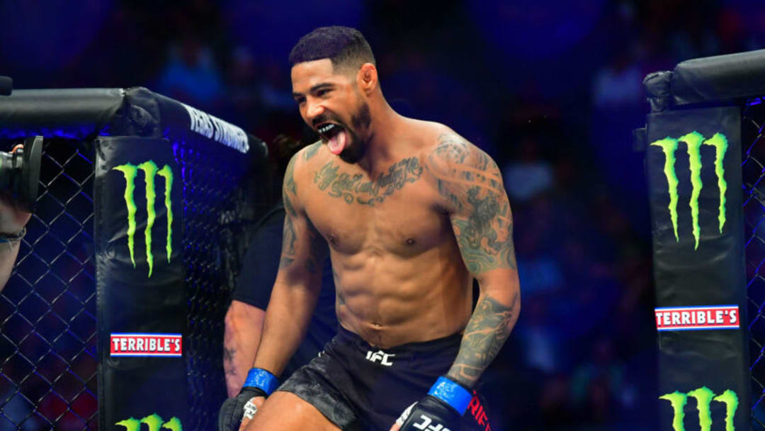 Mar 7, 2020; Las Vegas, Nevada, USA; Max Griffin (blue gloves) before the match against Alex Oliveira (red gloves) during UFC 248 at T-Mobile Arena. Mandatory Credit: Stephen R. Sylvanie-USA TODAY Sports