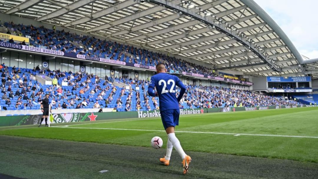 Socially distanced fans watch from the stands as Chelsea's Moroccan midfielder Hakim Ziyech goes to take a corner during the pre-season friendly football match between Brighton and Hove Albion and Chelsea at the American Express Community Stadium in Brighton, southern England on August 29, 2020. - The game is a 'pilot' event where a small number of fans will be present on a socially-distanced basis. The aim is to get fans back into stadiums in the Premier League by October. (Photo by Glyn KIRK / AFP) (Photo by GLYN KIRK/AFP via Getty Images)