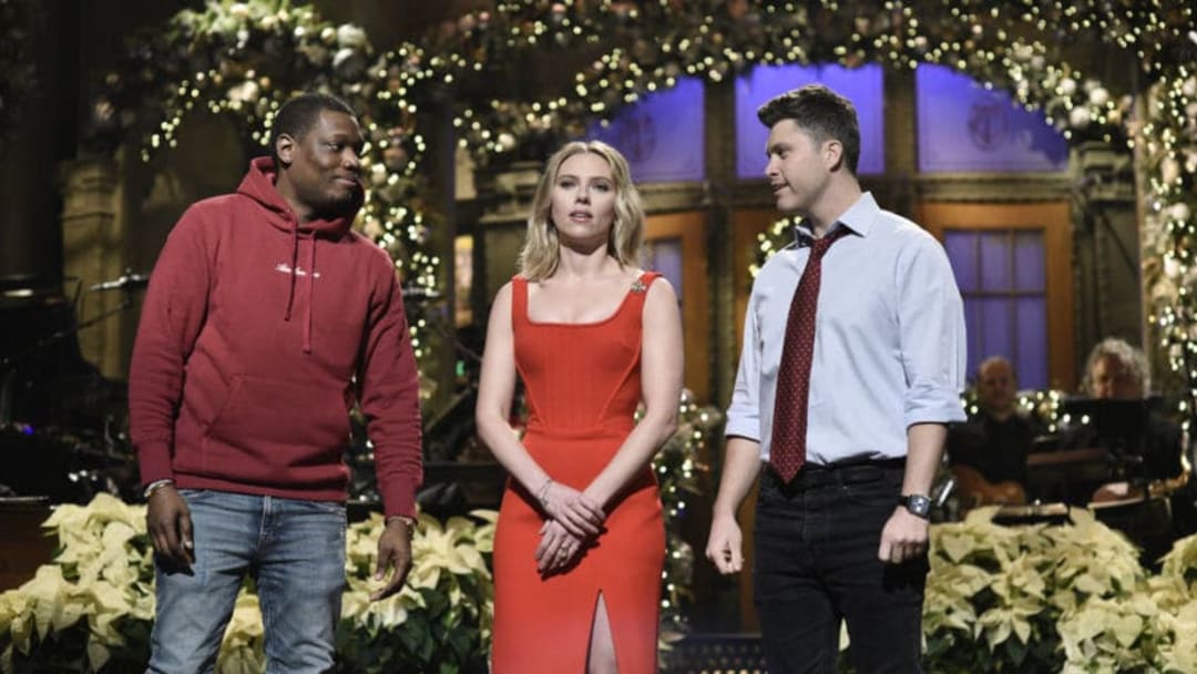 SATURDAY NIGHT LIVE -- "Scarlett Johansson" Episode 1776 -- Pictured: (l-r) Michael Che, host Scarlett Johansson, and Colin Jost during the Monologue on Saturday, December 14, 2019 -- (Photo by: Will Heath/NBC)