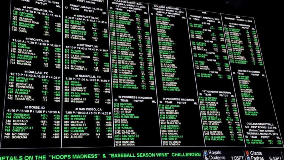 LAS VEGAS, NV - MARCH 15: Betting lines for college basketball games are displayed during a viewing party for the NCAA Men's College Basketball Tournament inside the 25,000-square-foot Race & Sports SuperBook at the Westgate Las Vegas Resort & Casino which features 4,488-square-feet of HD video screens on March 15, 2018 in Las Vegas, Nevada. (Photo by Ethan Miller/Getty Images)