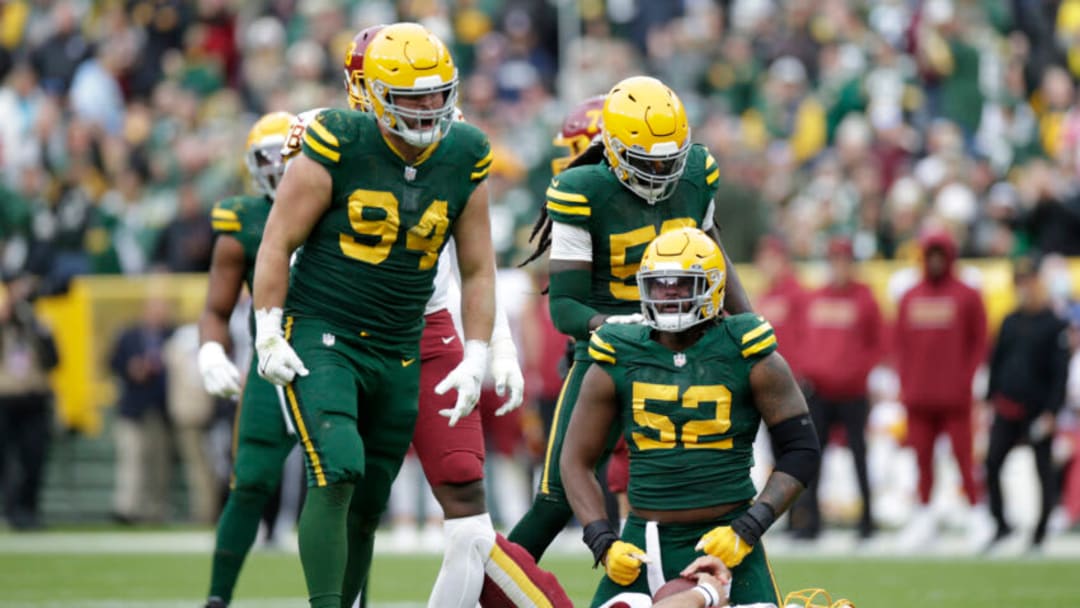 GREEN BAY, WISCONSIN - OCTOBER 24: Rashan Gary #52 of the Green Bay Packers reacts after sacking Taylor Heinicke #4 of the Washington Football Team in the fourth quarter in the game at Lambeau Field on October 24, 2021 in Green Bay, Wisconsin. (Photo by John Fisher/Getty Images)