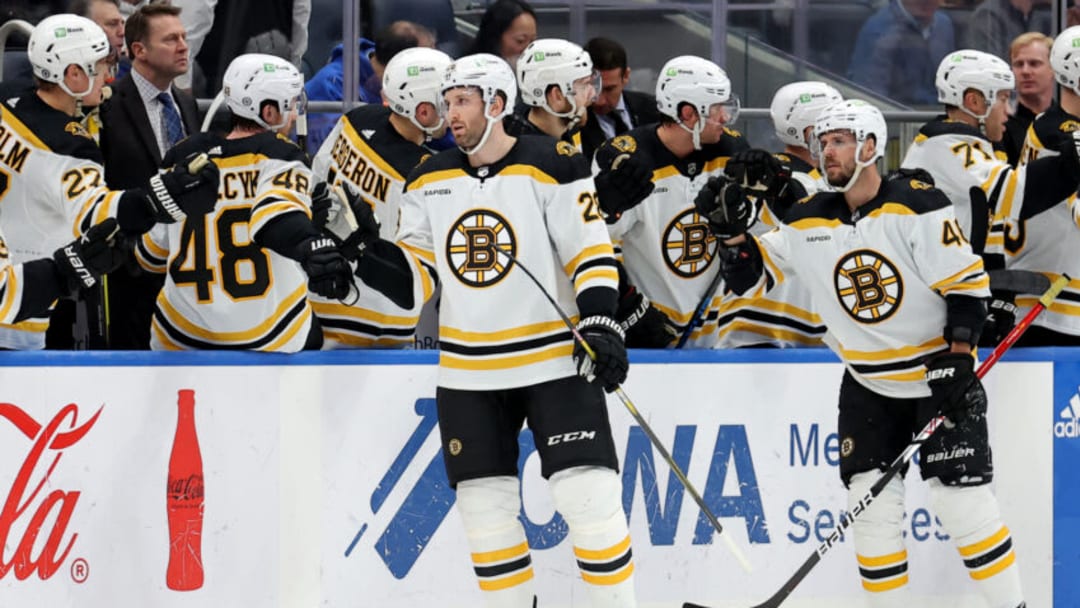 Boston Bruins defenseman Derek Forbort (28) celebrates his goal against the New York Islanders with teammates. Credit: Brad Penner-USA TODAY Sports