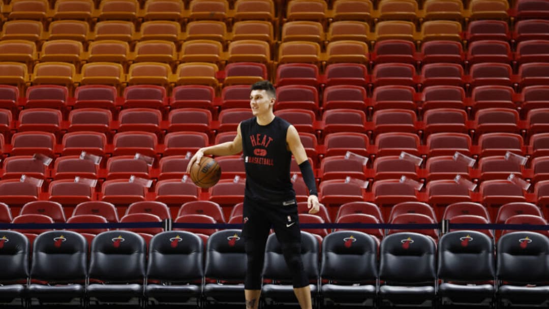MIAMI, FLORIDA - OCTOBER 15: Tyler Herro #14 of the Miami Heat warms up prior to the preseason game against the Boston Celtics at FTX Arena on October 15, 2021 in Miami, Florida. NOTE TO USER: User expressly acknowledges and agrees that, by downloading and or using this photograph, User is consenting to the terms and conditions of the Getty Images License Agreement. (Photo by Michael Reaves/Getty Images)