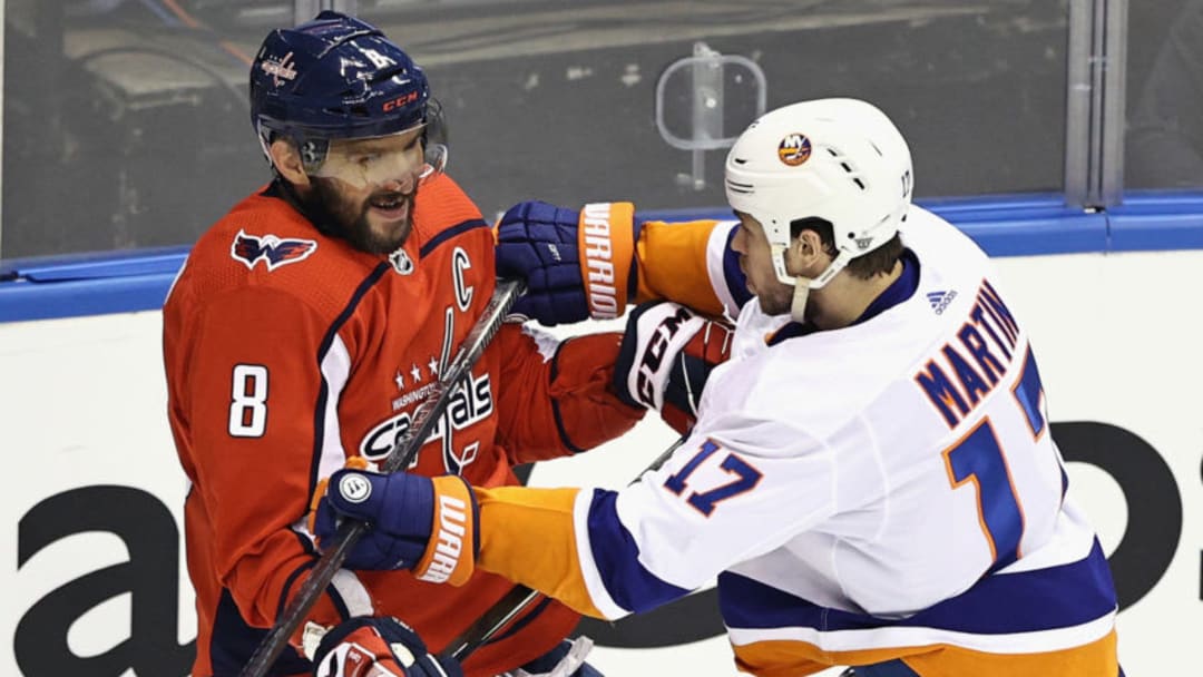 TORONTO, ONTARIO – AUGUST 12: Alex Ovechkin #8 of the Washington Capitals is pushed by Matt Martin #17 of the New York Islanders during the first period in Game One of the Eastern Conference First Round during the 2020 NHL Stanley Cup Playoffs at Scotiabank Arena on August 12, 2020 in Toronto, Ontario, Canada. (Photo by Elsa/Getty Images)