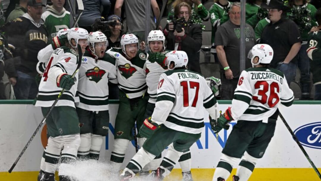 Minnesota Wild players celebrate along the boards after Ryan Hartman's goal ended Game 1 in the second overtime early Tuesday morning in Dallas.(Jerome Miron-USA TODAY Sports)