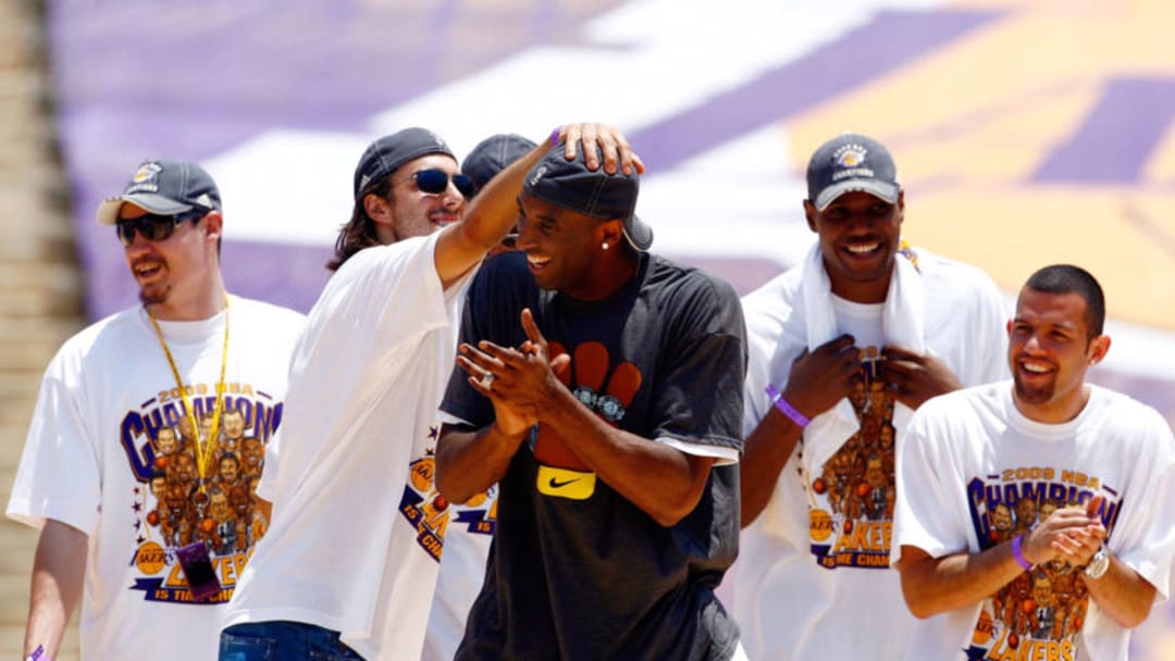 LOS ANGELES, CA - JUNE 17: (L-R) Adam Morrison, Sasha Vujacic, Kobe Bryant, Andrew Bynum and Jordan Farmar of the Los Angeles Lakers celebrate on stage during the 2009 NBA Championship Victory Parade at the Los Angeles Memorial Coliseum on June 17, 2009 in Los Angeles, California. (Photo by Jeff Gross/Getty Images)