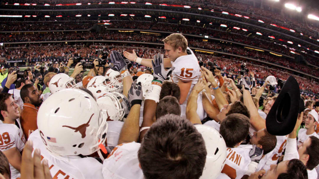 06 December 2009 - Hunter Lawrence (15) of the Texas Longhorns is mobbed by teammates after his 46 yard field goal as time expires during the Texas 13-12 win over Nebraska in the Big 12 Conference championship game at Cowboys Stadium in Arlington, Texas. (Photo by James D. Smith/Icon SMI/Icon Sport Media via Getty Images)