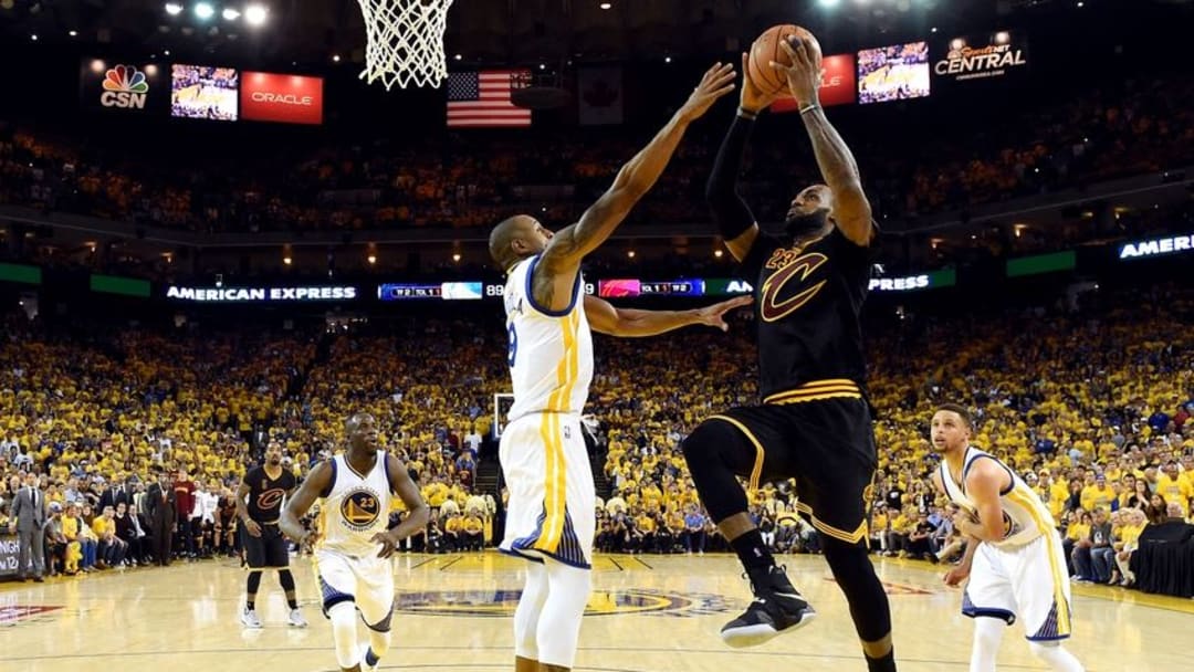 Jun 19, 2016; Oakland, CA, USA; Cleveland Cavaliers forward LeBron James (23) shoots the ball against Golden State Warriors forward Andre Iguodala (9) in game seven of the NBA Finals at Oracle Arena. Mandatory Credit: Bob Donnan-USA TODAY Sports
