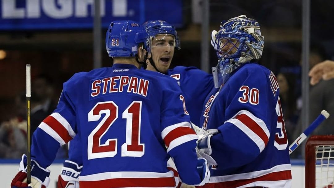 NHL Power Rankings: New York Rangers goalie Henrik Lundqvist (30) celebrates with New York Rangers defenseman Ryan McDonagh (27) and New York Rangers center Derek Stepan (21) after defeating the St. Louis Blues at Madison Square Garden. Mandatory Credit: Adam Hunger-USA TODAY Sports