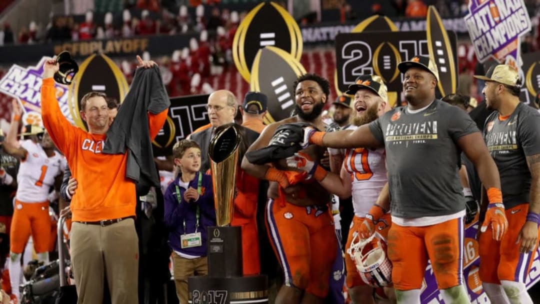 TAMPA, FL - JANUARY 09: Head coach Dabo Swinney of the Clemson Tigers (L) and defensive tackle Christian Wilkins