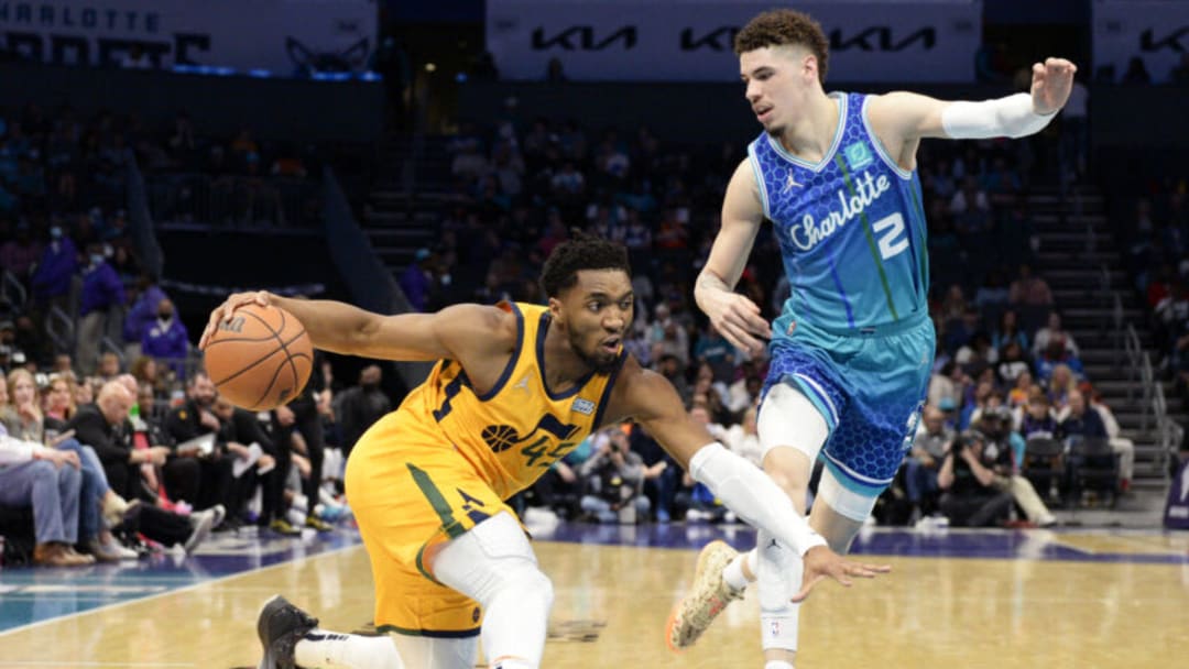 CHARLOTTE, NORTH CAROLINA - MARCH 25: Donovan Mitchell #45 of the Utah Jazz fakes out LaMelo Ball #2 of the Charlotte Hornets during the second quarter at Spectrum Center on March 25, 2022 in Charlotte, North Carolina. NOTE TO USER: User expressly acknowledges and agrees that, by downloading and or using this photograph, User is consenting to the terms and conditions of the Getty Images License Agreement. (Photo by Eakin Howard/Getty Images)