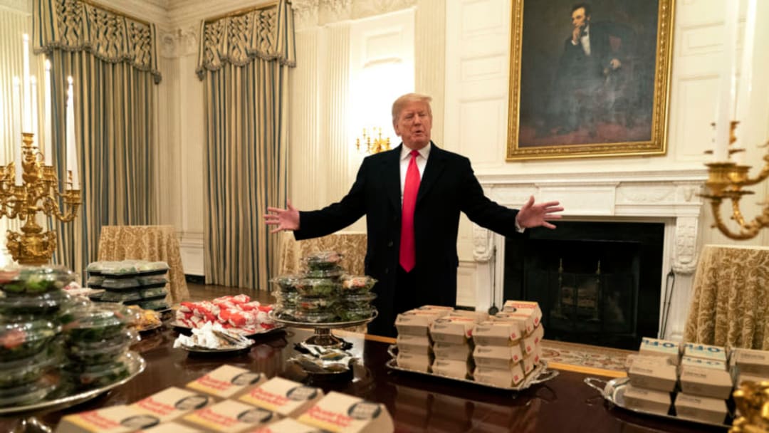 WASHINGTON, DC - JANUARY 14: (AFP OUT) U.S President Donald Trump presents fast food to be served to the Clemson Tigers football team to celebrate their Championship at the White House on January 14, 2019 in Washington, DC. (Photo by Chris Kleponis-Pool/Getty Images)