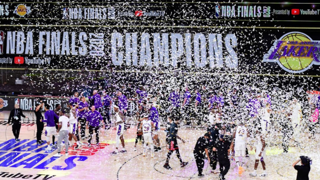 LAKE BUENA VISTA, FLORIDA - OCTOBER 11: The Los Angeles Lakers celebrate with the trophy after winning the 2020 NBA Championship Final over the Miami Heat in Game Six of the 2020 NBA Finals at AdventHealth Arena at the ESPN Wide World Of Sports Complex on October 11, 2020 in Lake Buena Vista, Florida. NOTE TO USER: User expressly acknowledges and agrees that, by downloading and or using this photograph, User is consenting to the terms and conditions of the Getty Images License Agreement. (Photo by Douglas P. DeFelice/Getty Images)