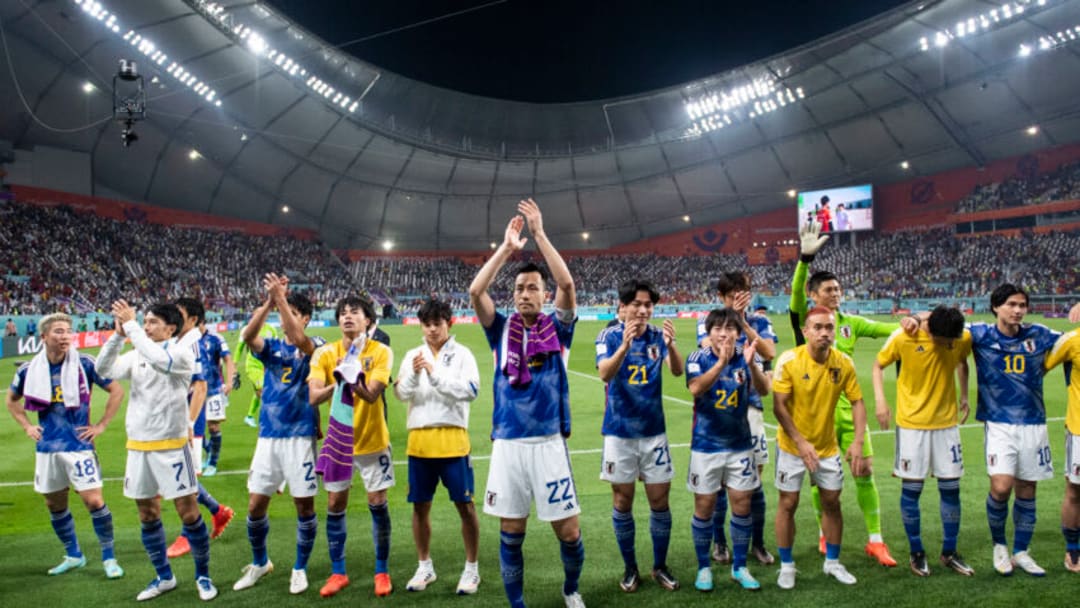 DOHA, QATAR - DECEMBER 01: Japan players celebrate winning the group as they applaud their fans at the end of the FIFA World Cup Qatar 2022 Group E match between Japan and Spain at Khalifa International Stadium on December 1, 2022 in Doha, Qatar. (Photo by Sebastian Frej/MB Media)