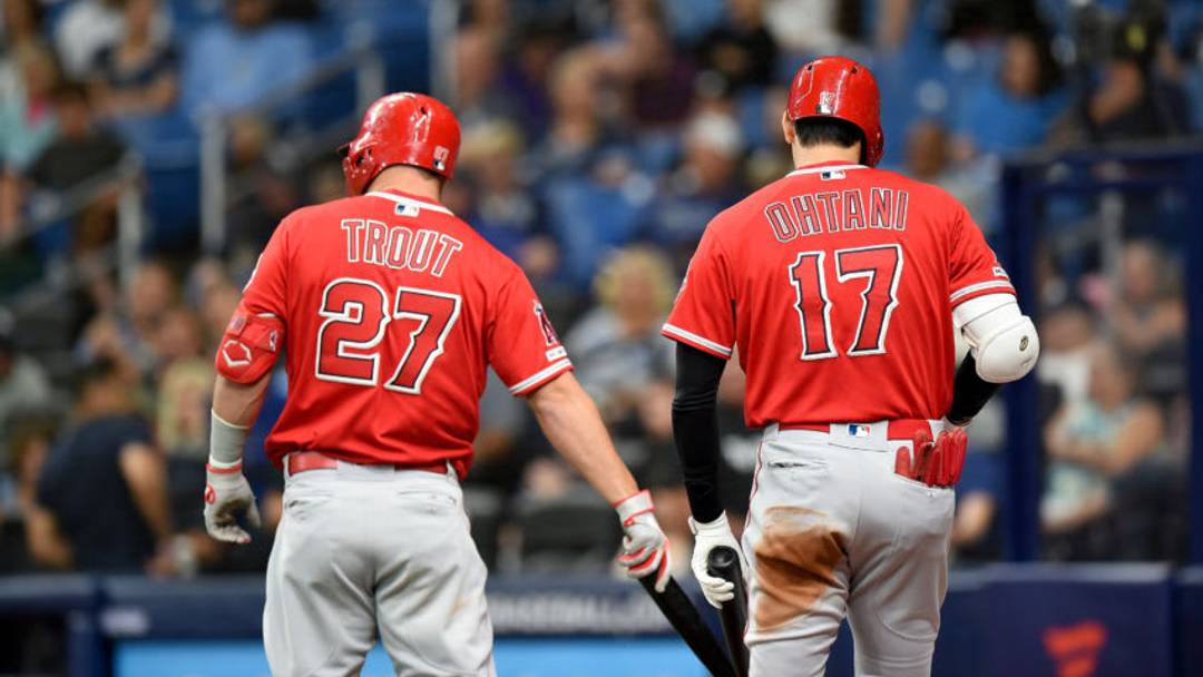 ST PETERSBURG, FL - JUNE 14: Mike Trout #27 and Shohei Ohtani #17 of the Los Angeles Angels get ready to bat against the Tampa Bay Rays at Tropicana Field on June 14, 2019 in St Petersburg, Florida. (Photo by G Fiume/Getty Images)