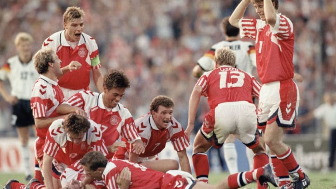 GOTHENBURG, SWEDEN - JUNE 26: Kim Vilfort of Denmark is mobbed by team-mates after scoring the second and winning goal during the UEFA European Championships 1992 Final between Denmark and Germany held at the Ullevi Stadium on June 26, 1992 in Gothernburg, Sweden. (Photo by Shaun Botterill/Allsport/Getty Images)