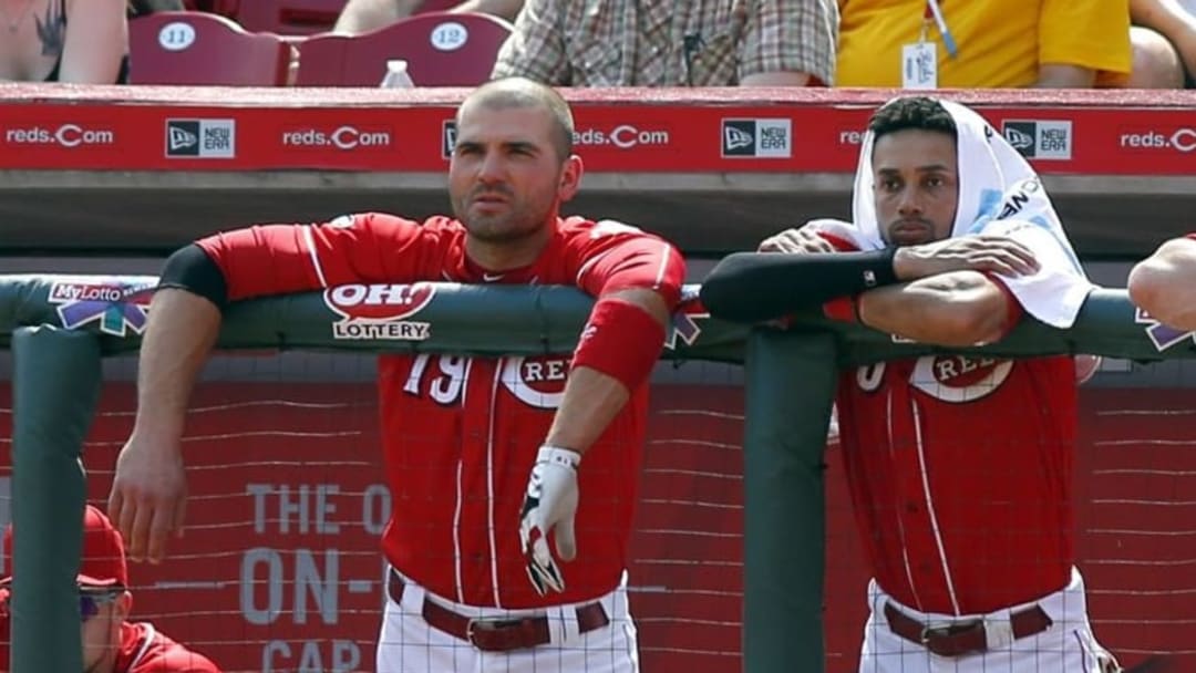 Apr 20, 2016; Cincinnati, OH, USA; Cincinnati Reds first baseman Joey Votto (19) and center fielder Billy Hamilton (6) watch from the dugout during a game with the Colorado Rockies at Great American Ball Park. The Reds won 6-5. Mandatory Credit: David Kohl-USA TODAY Sports