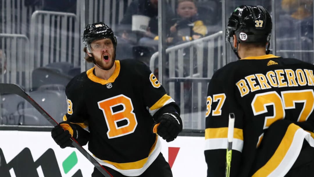 Apr 29, 2021; Boston, Massachusetts, USA; Boston Bruins right wing David Pastrnak (88) celebrates his goal against the Buffalo Sabres with center Patrice Bergeron (37) during the first period at TD Garden. Mandatory Credit: Winslow Townson-USA TODAY Sports