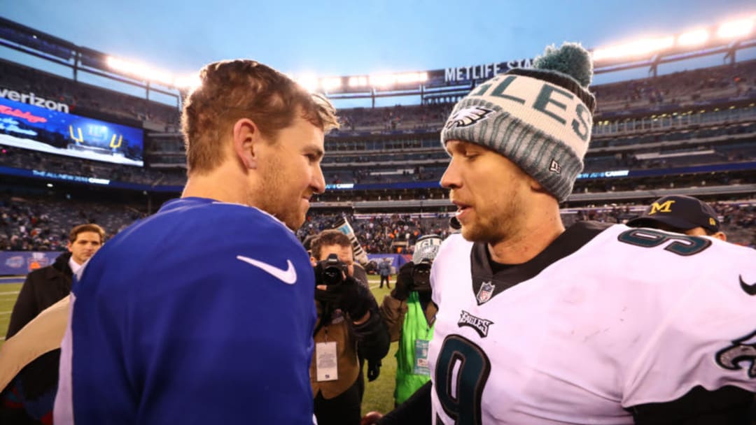 EAST RUTHERFORD, NEW JERSEY - DECEMBER 17: Eli Manning #10 of the New York Giants and Nick Foles #9 of the Philadelphia Eagles meet after the eagles 34-29 win at MetLife Stadium on December 17, 2017 in East Rutherford, New Jersey. (Photo by Al Bello/Getty Images)