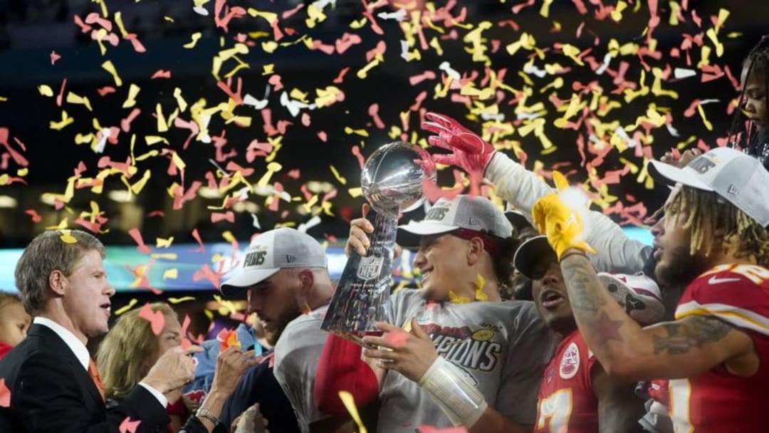 (L-R) CEO of the Kansas City Chiefs Clark Hunt, Tight End Travis Kelce, Quarterback Patrick Mahomes (holding the Lombardi trophy), Wide receiver Mecole Hardman and Strong safety Tyrann Mathieu celebrate after winning Super Bowl LIV between the Kansas City Chiefs and the San Francisco 49ers at Hard Rock Stadium in Miami Gardens, Florida, on February 2, 2020. (Photo by TIMOTHY A. CLARY / AFP) (Photo by TIMOTHY A. CLARY/AFP via Getty Images)