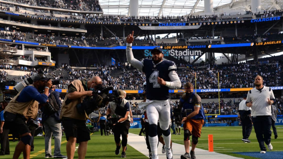 Sep 19, 2021; Inglewood, California, USA; Dallas Cowboys quarterback Dak Prescott (4) gestures as he runs off the field after defeating the Los Angeles Chargers at SoFi Stadium. Mandatory Credit: Orlando Ramirez-USA TODAY Sports