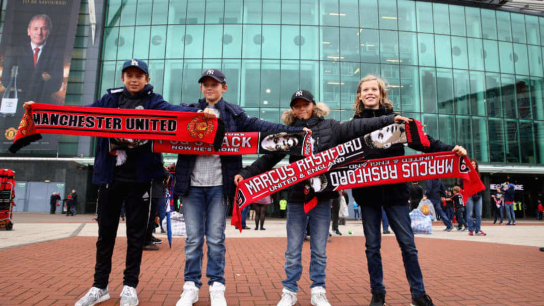 MANCHESTER, ENGLAND - SEPTEMBER 30: Manchester United fans pose for a team photo prior to the Premier League match between Manchester United and Crystal Palace at Old Trafford on September 30, 2017 in Manchester, England. (Photo by Clive Brunskill/Getty Images)