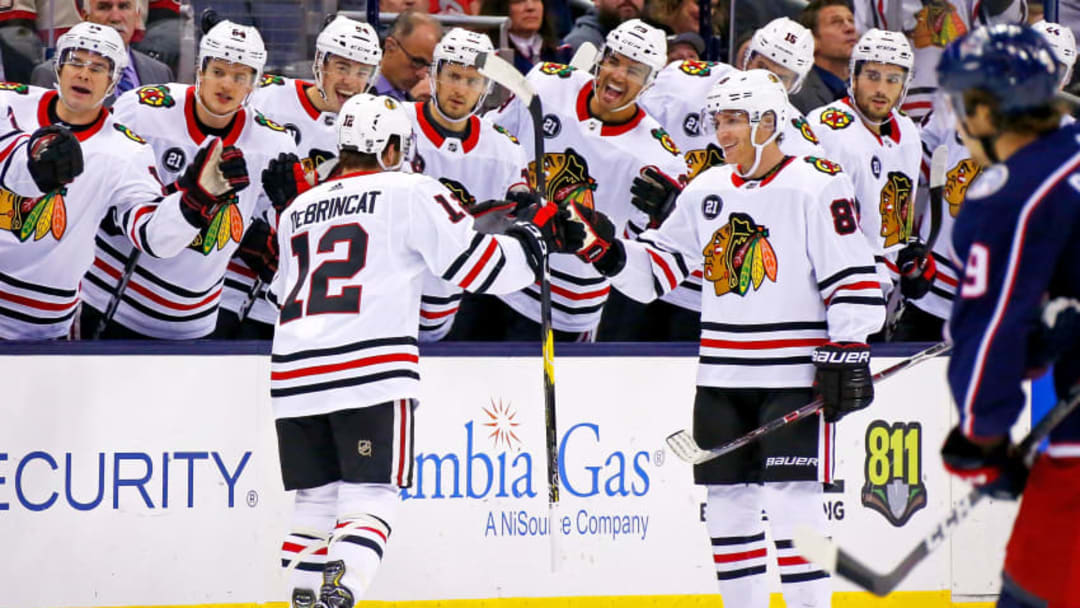 NHL DFS: COLUMBUS, OH - OCTOBER 20: Alex DeBrincat #12 of the Chicago Blackhawks is congratulated by Patrick Kane #88 after scoring a goal during the first period of the game against the Columbus Blue Jackets on October 20, 2018 at Nationwide Arena in Columbus, Ohio. (Photo by Kirk Irwin/Getty Images)