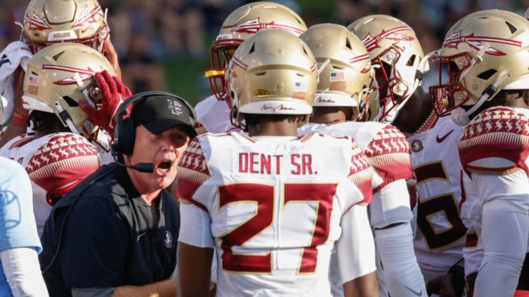 Sep 18, 2021; Winston-Salem, North Carolina, USA; Florida State Seminoles defensive back Akeem Dent Sr. (27) listens to defensive coordinator Adam Fuller (left) as he talks with the defensive unit during the second half against the Wake Forest Demon Deacons at Truist Field. Mandatory Credit: Reinhold Matay-USA TODAY Sports