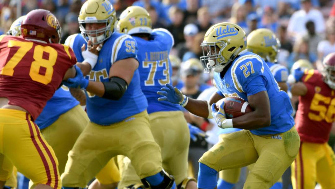 PASADENA, CALIFORNIA - NOVEMBER 17: Joshua Kelley #27 of the UCLA Bruins runs during the second quarter against the USC Trojans at Rose Bowl on November 17, 2018 in Pasadena, California. (Photo by Harry How/Getty Images)