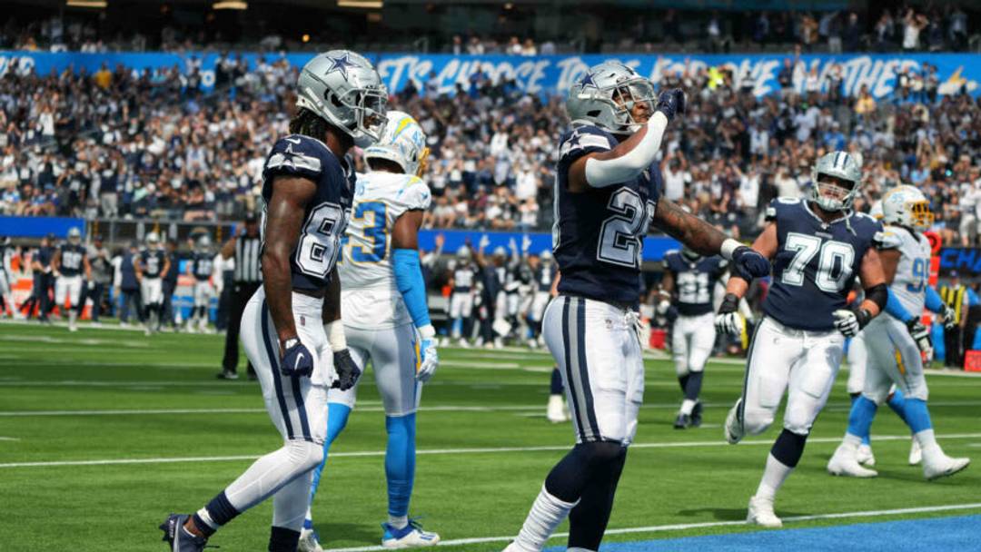 Sep 19, 2021; Inglewood, California, USA; Dallas Cowboys running back Tony Pollard (20) celebrates with wide receiver CeeDee Lamb (88) after scoring on a 4-yard touchdown run in the first quarter against the Los Angeles Chargers at SoFi Stadium. Mandatory Credit: Kirby Lee-USA TODAY Sports