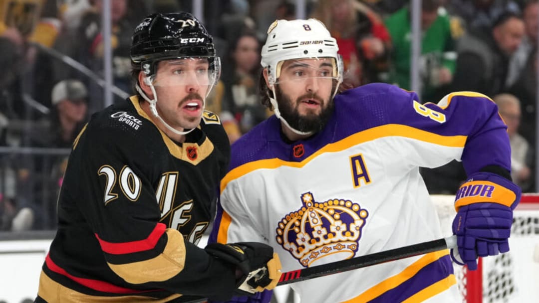 Jan 7, 2023; Las Vegas, Nevada, USA; Los Angeles Kings defenseman Drew Doughty (8) holds the stick of Vegas Golden Knights center Chandler Stephenson (20) during the second period at T-Mobile Arena. Mandatory Credit: Stephen R. Sylvanie-USA TODAY Sports