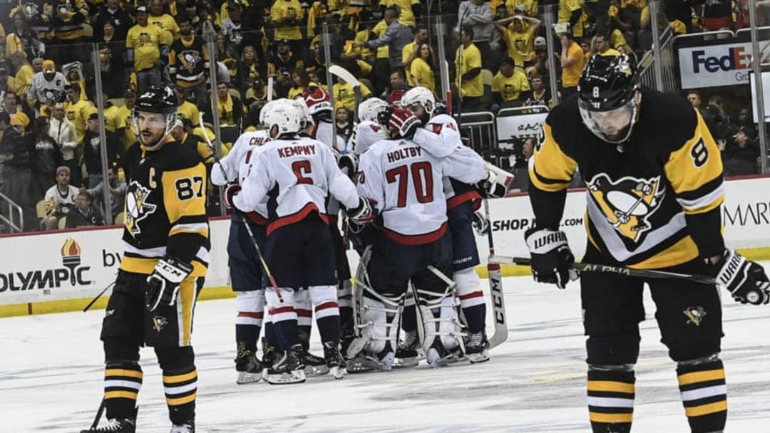 PITTSBURGH, PA - MAY 7:?p87/, left, skates away as the Washington Capitals celebrate after wining dGame 6 of the Second Round of the Stanley Cup Playoffs between the Washington Capitals and the Pittsburgh Penguins at PPG Paints Arena on Monday, May 7, 2018. The Washington Capitals won 2-1 to advance the next round. (Photo by Toni L. Sandys/The Washington Post via Getty Images)