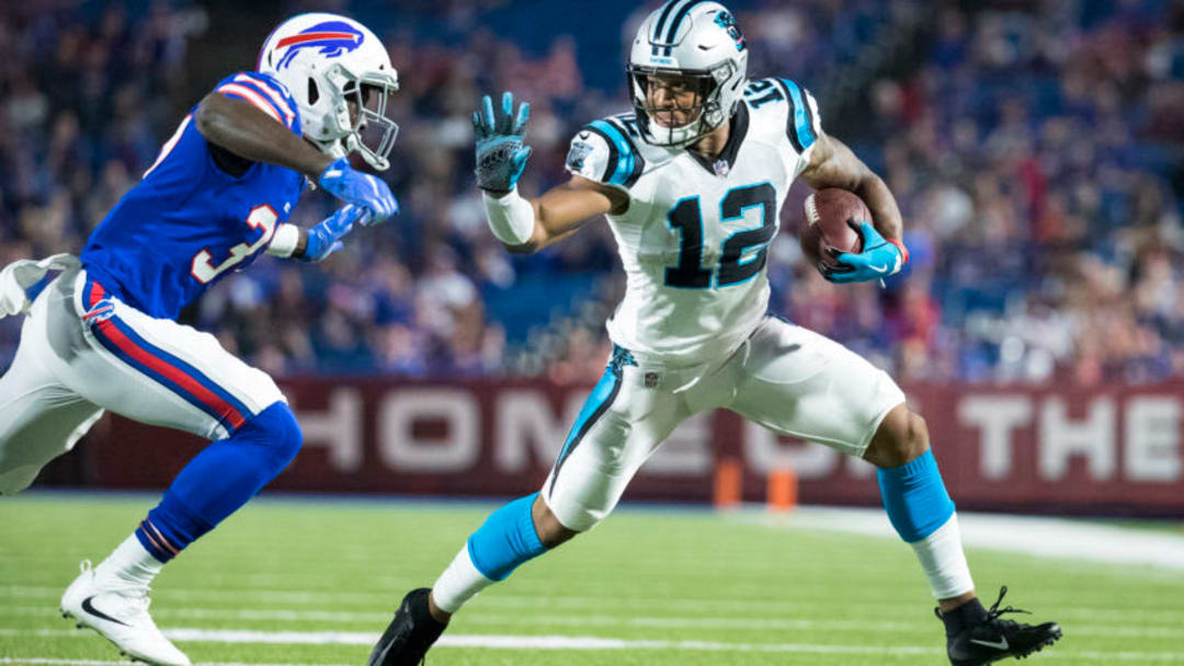 ORCHARD PARK, NY - AUGUST 09: DJ Moore #12 of the Carolina Panthers attempts to fend off Kelcie McCray #37 of the Buffalo Bills while carrying the ball during the second half at New Era Field on August 9, 2018 in Orchard Park, New York. Carolina defeats Buffalo in the preseason game 28-23. (Photo by Brett Carlsen/Getty Images)