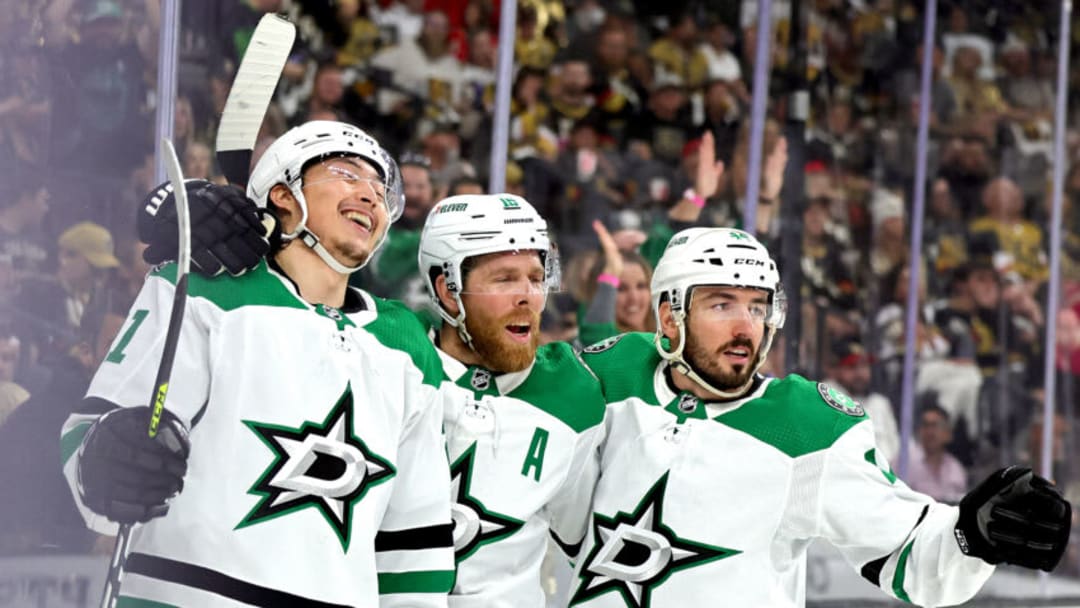 LAS VEGAS, NEVADA - MAY 19: Jason Robertson #21 of the Dallas Stars is congratulated by his teammates Joe Pavelski #16 and Joel Hanley #44 after scoring a goal against the Vegas Golden Knights during the first period in Game One of the Western Conference Final of the 2023 Stanley Cup Playoffs at T-Mobile Arena on May 19, 2023 in Las Vegas, Nevada. (Photo by Ethan Miller/Getty Images)