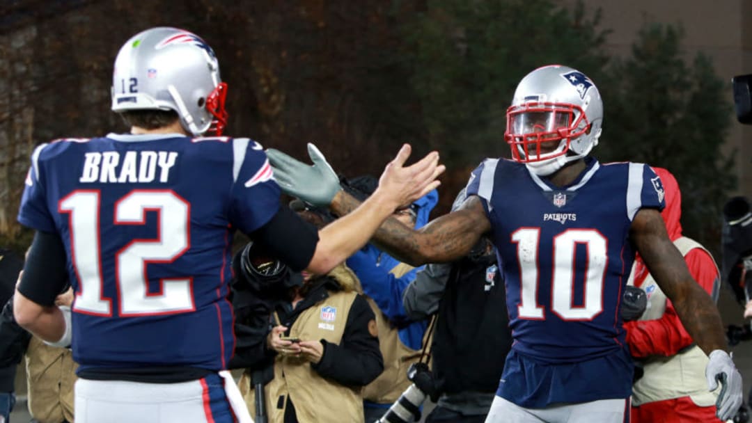 FOXBOROUGH, MA - DECEMBER 2: Patriots quarterback Tom Brady (left) congratulates Josh Gordon after his touchdown in the third quarter. The New England Patriots play against the Minnesota Vikings at Gillette Stadium in Foxborough on Dec. 02, 2018. (Photo by Jim Davis/The Boston Globe via Getty Images)