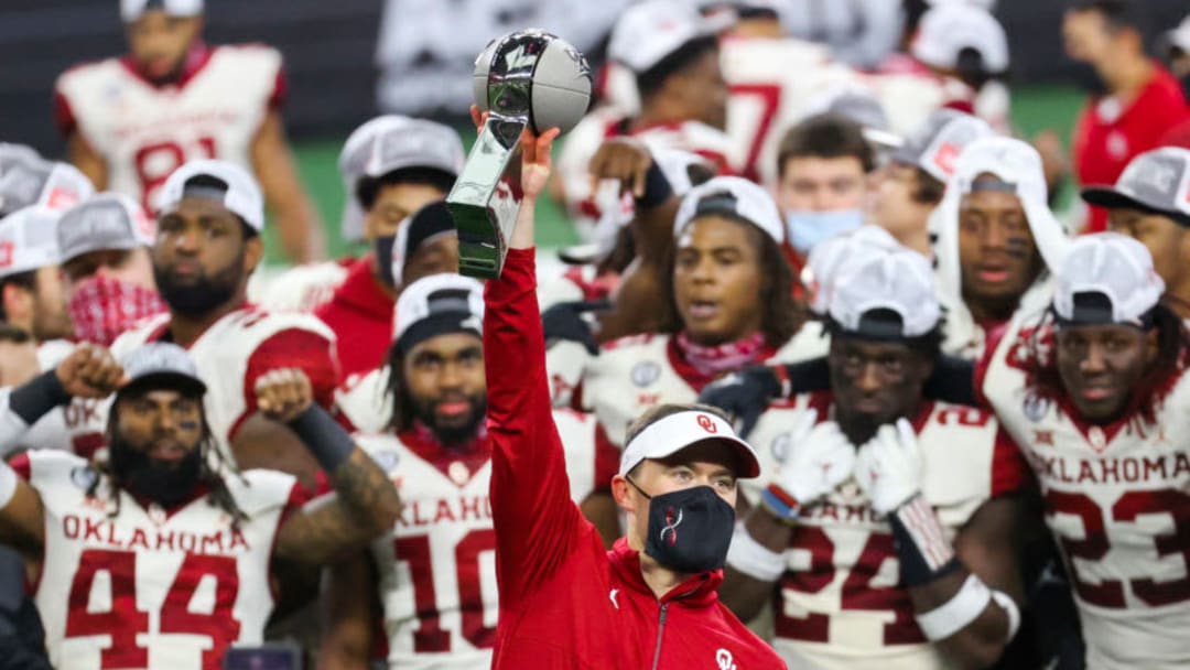 Oklahoma Sooners head coach Lincoln Riley lifts the Big 12 Championship trophy after the game against the Iowa State Cyclones at AT&T Stadium. Mandatory Credit: Kevin Jairaj-USA TODAY Sports
