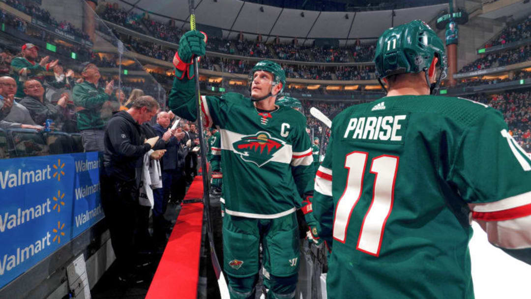 SAINT PAUL, MN - DECEMBER 1: Mikko Koivu #9 of the Minnesota Wild acknowledges the crowd while being recognized for playing in his 1000th career game against the Dallas Stars at the Xcel Energy Center on December 1, 2019 in Saint Paul, Minnesota. (Photo by Bruce Kluckhohn/NHLI via Getty Images)