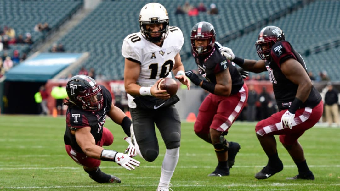 PHILADELPHIA, PA - NOVEMBER 18: McKenzie Milton #10 of the UCF Knights walks in for the first touchdown of the game against the Temple Owls during the first quarter at Lincoln Financial Field on November 18, 2017 in Philadelphia, Pennsylvania. (Photo by Corey Perrine/Getty Images)