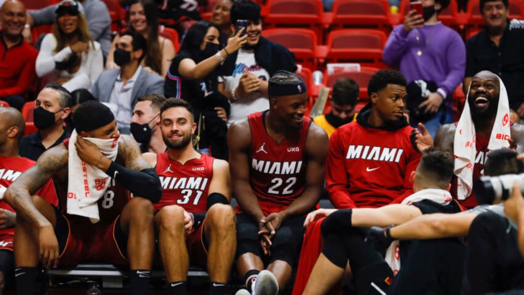 Oct 21, 2021; Miami, Florida, USA; Miami Heat forward Markieff Morris (8), guard Max Strus (31), forward Jimmy Butler (22), guard Kyle Lowry (7) and center Dewayne Dedmon (21) reacts from the bench during the fourth quarter of the game at FTX Arena. Mandatory Credit: Sam Navarro-USA TODAY Sports