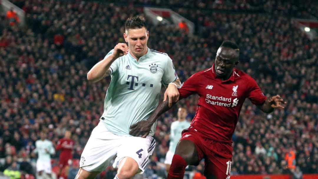 LIVERPOOL, ENGLAND - FEBRUARY 19: Bayern Munich's Niklas Sule battles with Liverpool's Sadio Mane during the UEFA Champions League Round of 16 First Leg match between Liverpool and FC Bayern Muenchen at Anfield on February 19, 2019 in Liverpool, England. (Photo by Rich Linley - CameraSport via Getty Images)