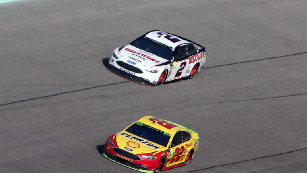 HOMESTEAD, FL - NOVEMBER 18: Joey Logano (22) passes Brad Keselowski (2) in turn four during the NASCAR Monster Energy Series Ford EcoBoost 400 at Homestead-Miami Speedway in Homestead, FL on November 18, 2018. (Photo by Michael Bush/Icon Sportswire via Getty Images)