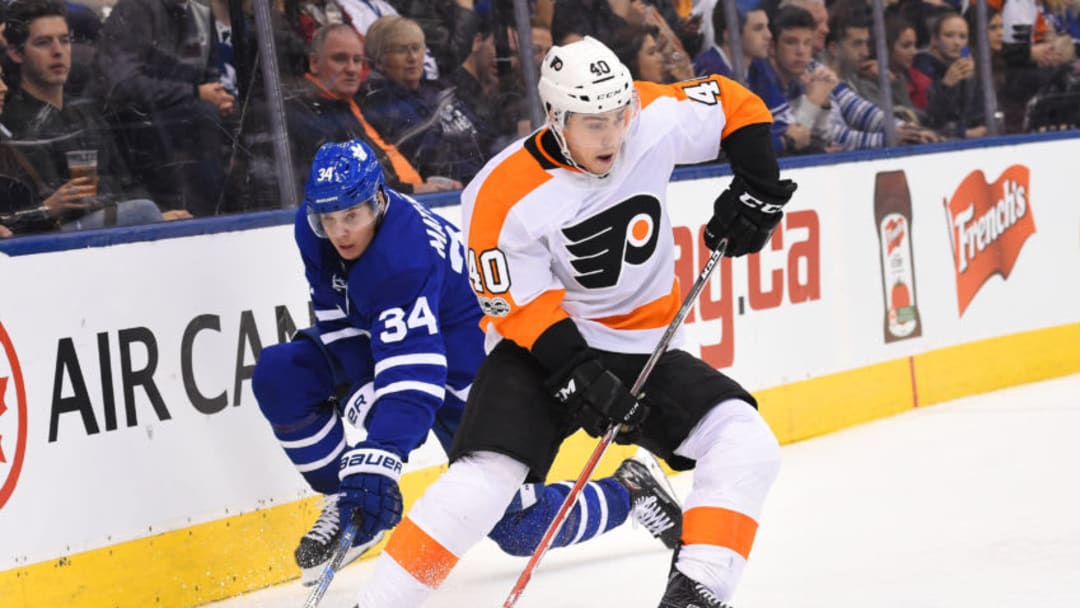 TORONTO, ON - OCTOBER 28: Toronto Maple Leafs center Auston Matthews (34) battles for a puck with Philadelphia Flyers center Jordan Weal (40) in the third period during a game between the Philadelphia Flyers and the Toronto Maple Leafs on October 28, 2017 at Air Canada Centre in Toronto, Ontario Canada. The Philadelphia Flyers won 4-2. (Photo by Nick Turchiaro/Icon Sportswire via Getty Images)