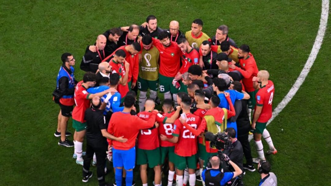 Morocco team react at the end of the Qatar 2022 World Cup football semi-final match between France and Morocco at the Al-Bayt Stadium in Al Khor, north of Doha on December 14, 2022. (Photo by Antonin THUILLIER / AFP) (Photo by ANTONIN THUILLIER/AFP via Getty Images)